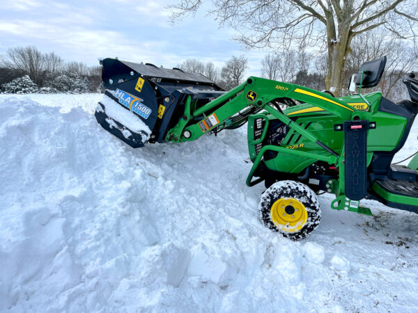 HLA 1500 Snow Pusher Pushing onto Snow Pile