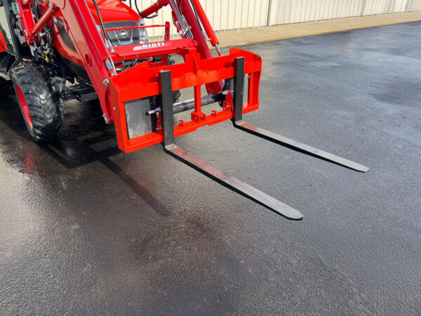 Orange VersaForks on Front-End Loader