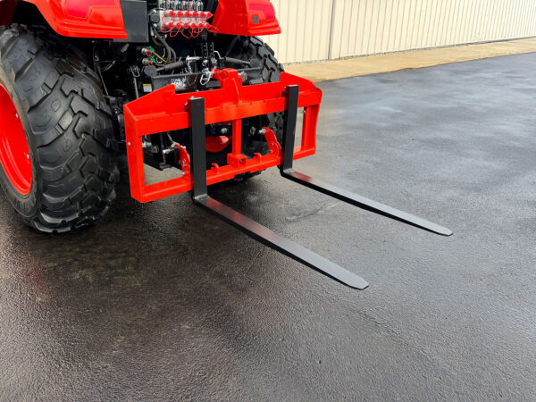 Orange VersaForks on 3-Point Hitch